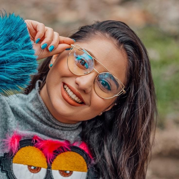 Kaveri Mehta, Lead Design Curator at TruePaperGrove, reviewing corporate floral arrangements